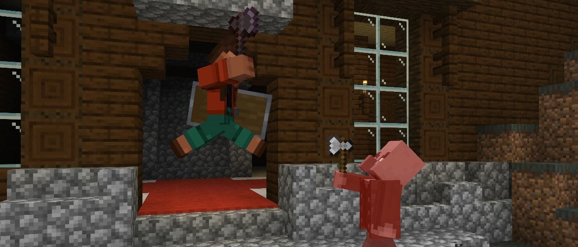 Noor is attacking a vindicator with a netherite axe in front of a woodland mansion.