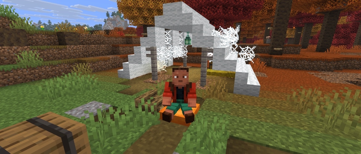 Noor sits on an orange cushion in an abandoned camp in a dappled forest.