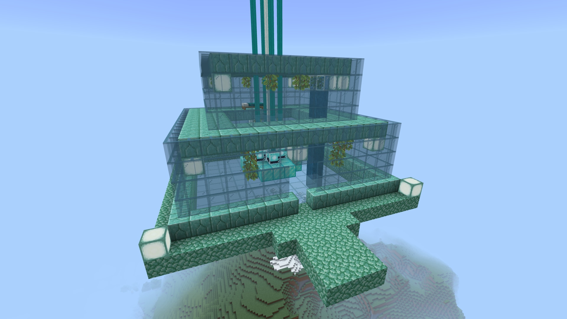 Blueish green two story building built in Minecraft made out of stone blocks, clear glass blocks, and hanging greenery.