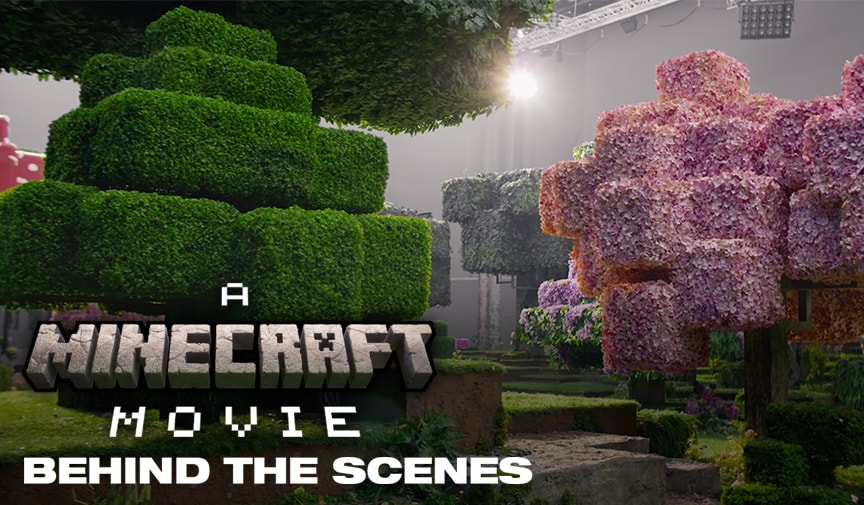 A photo from the set of A MINECRAFT MOVIE, featuring a Minecraft forest translated into real life. The set consists of terrain and trees made from block-shaped parts, including one cherry blossom tree.