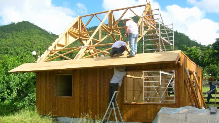 A photo of a house completely made out of bamboo.