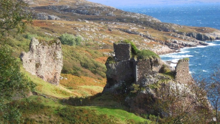 A photo of an ancient bastion on a rocky coast, with the ocean seen in the background.