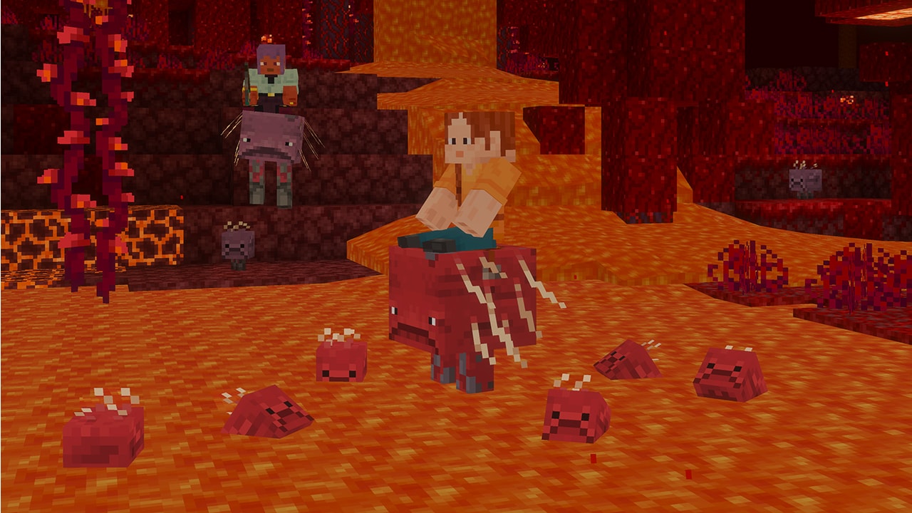 A player rides a strider across molten lava in the Nether. Tiny grumpy baby striders bounce in the lava nearby while another character watches from a rocky ledge.