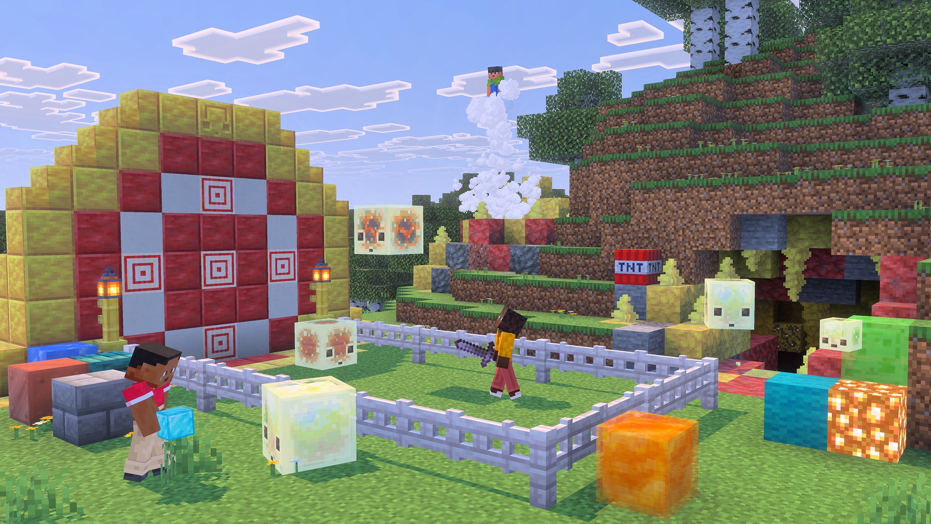 A player bounces a sulfur cube toward a large red and white target while another offers an ice block to a sulfur cube, and a third player rides a geyser into the air.