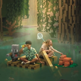Two children sitting on a wooden raft and one child holds a paddle, while another sits and a small robot watches.