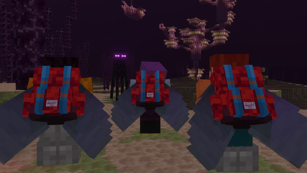 Three players wearing Herschel backpacks glide through the End with elytra as an Enderman watches nearby beneath towering chorus plants.