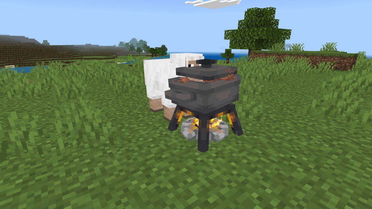 A campfire with a cooking pot simmers in a grassy biome while a sheep stands close by, watching the pot.
