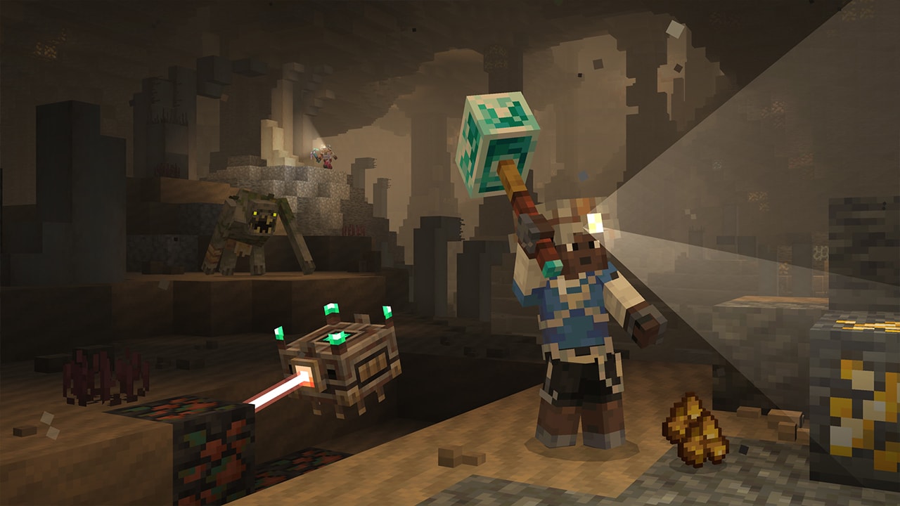 Person inside a cave wearing a helmet with a torch