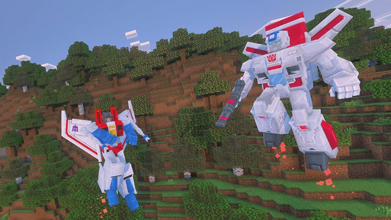 Two transformers, Starscream and Jetfire, hovering above a forest biome in Minecraft.