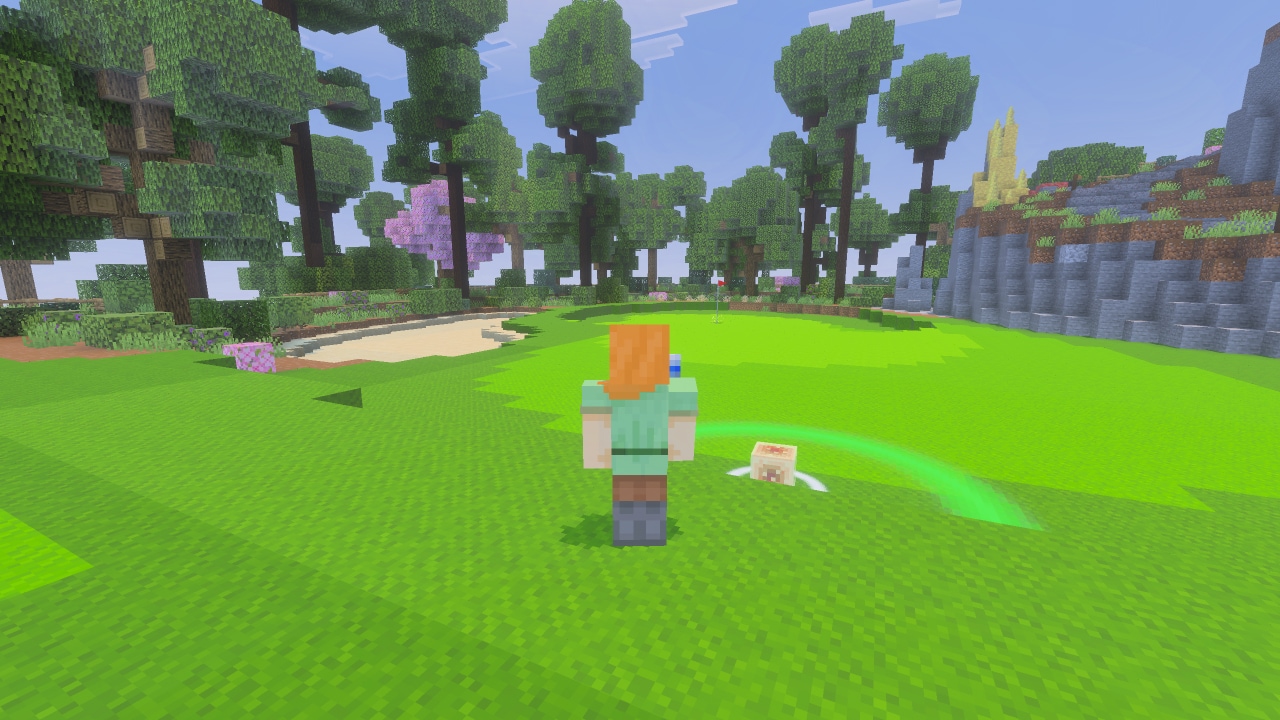 A player stands on a bright green golf course surrounded by trees while guiding a sulfur cube toward a distant hole.