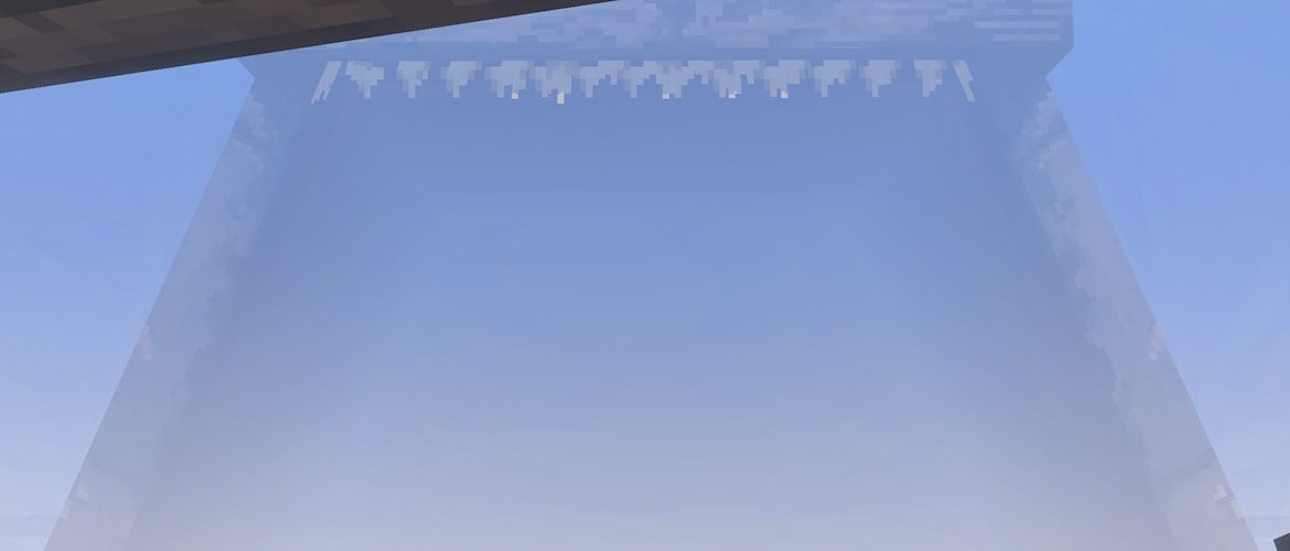 The enormous mouth of a giant sea creature emerges through the fog, filling the view with an ominous silhouette.