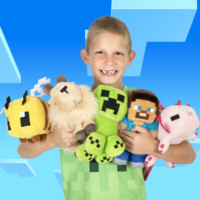 A smiling boy holds a collection of plushies, including a bee, a goat, a creeper, Steve, and an axolotl.