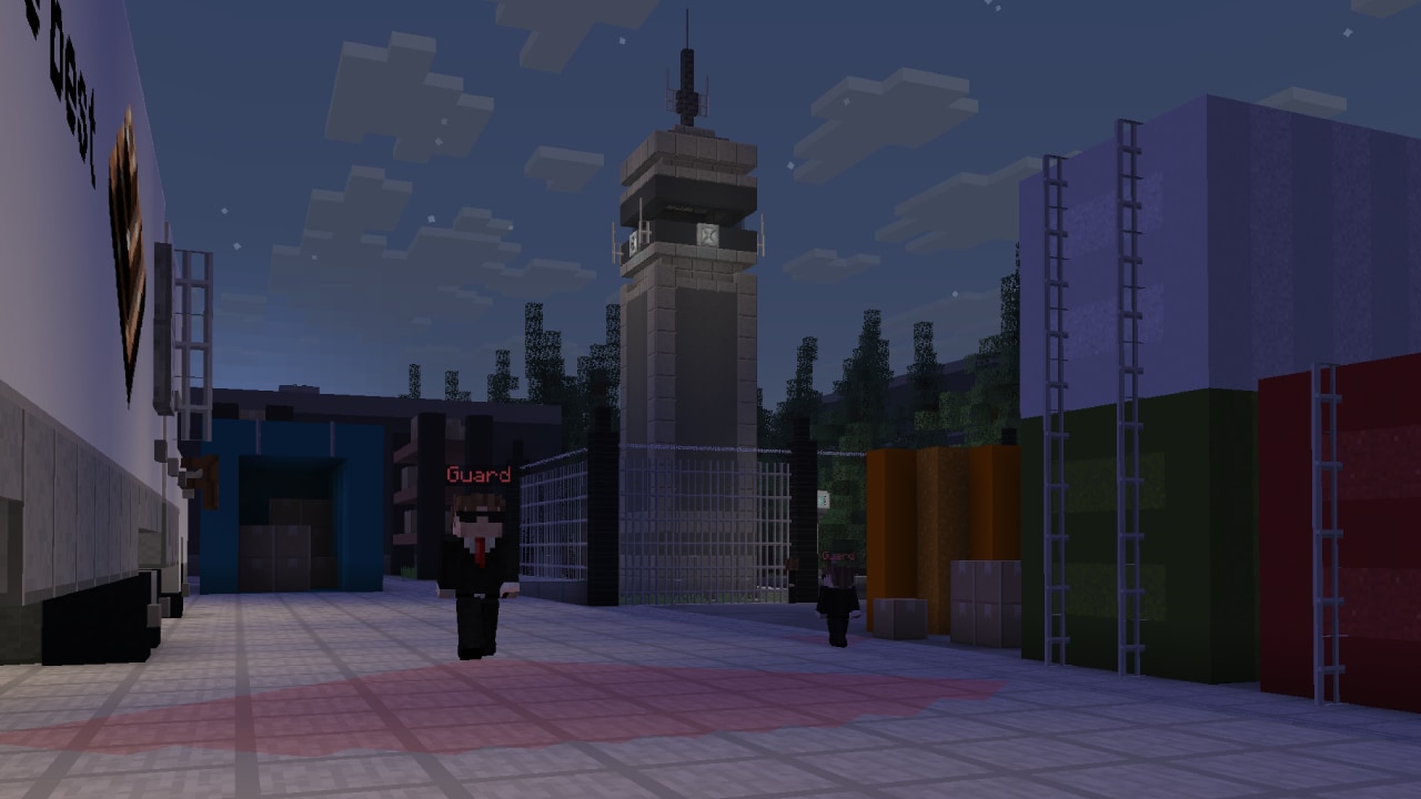 A secure facility with guards, watchtower, and fenced compound.