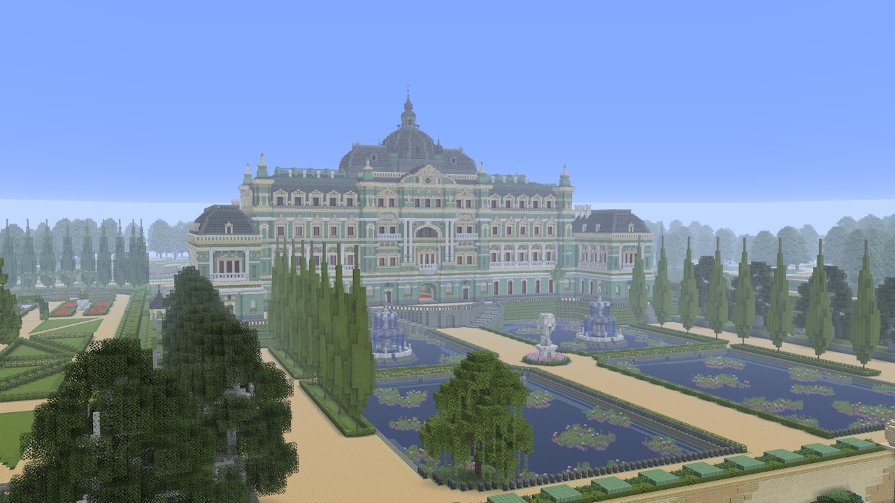 An ornate palace with green rooftops overlooks symmetrical gardens, fountains, and tree-lined pathways in a grand estate landscape.