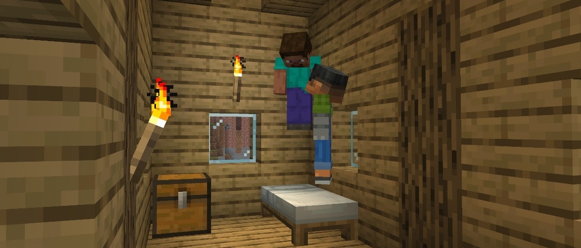 Steve and Sunny are jumping in a white bed inside a Plains village house