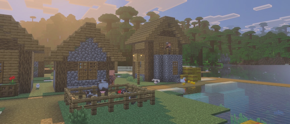 A Minecraft Village with some animals and villagers. There is a Jungle Temple in the background, across the water.