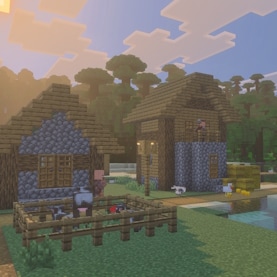 A Minecraft Village with some animals and villagers. There is a Jungle Temple in the background, across the water.