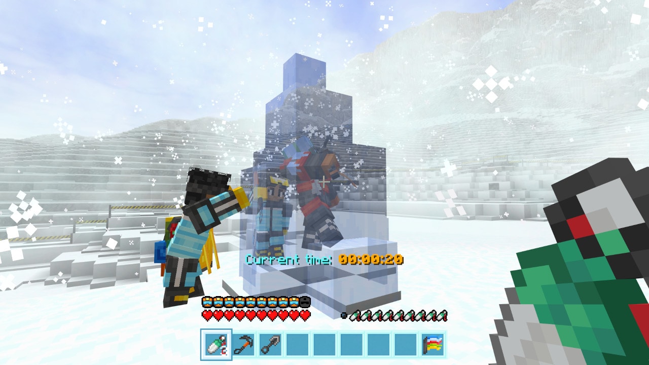 Two climbers working together to free a teammate encased in ice on a snow-covered plateau