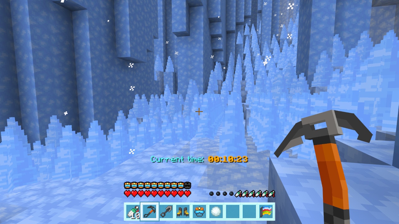 Narrow ice corridor filled with tall blue ice spikes as a climber advances with an ice pick