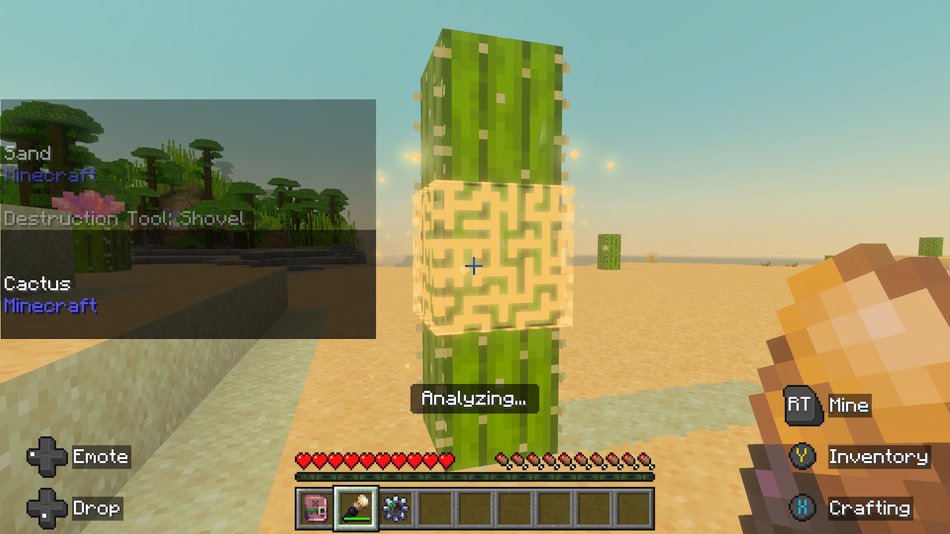 Minecraft player uses an analyzing tool on a cactus block in a bright sandy desert environment.