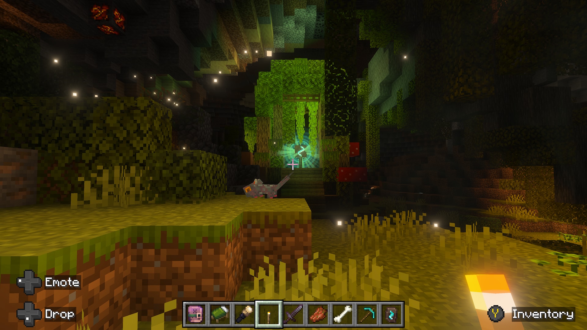 Minecraft player approaches a glowing green structure surrounded by dense vegetation and a small creature in a vast underground cave.