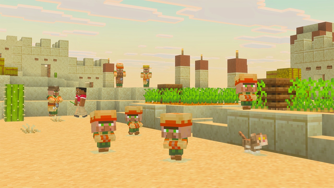 A desert village with multiple baby villagers walking along in new outfits and smaller noses onsandy paths. Stone buildings surround a walled farm with green crops, and a cat rests nearby.