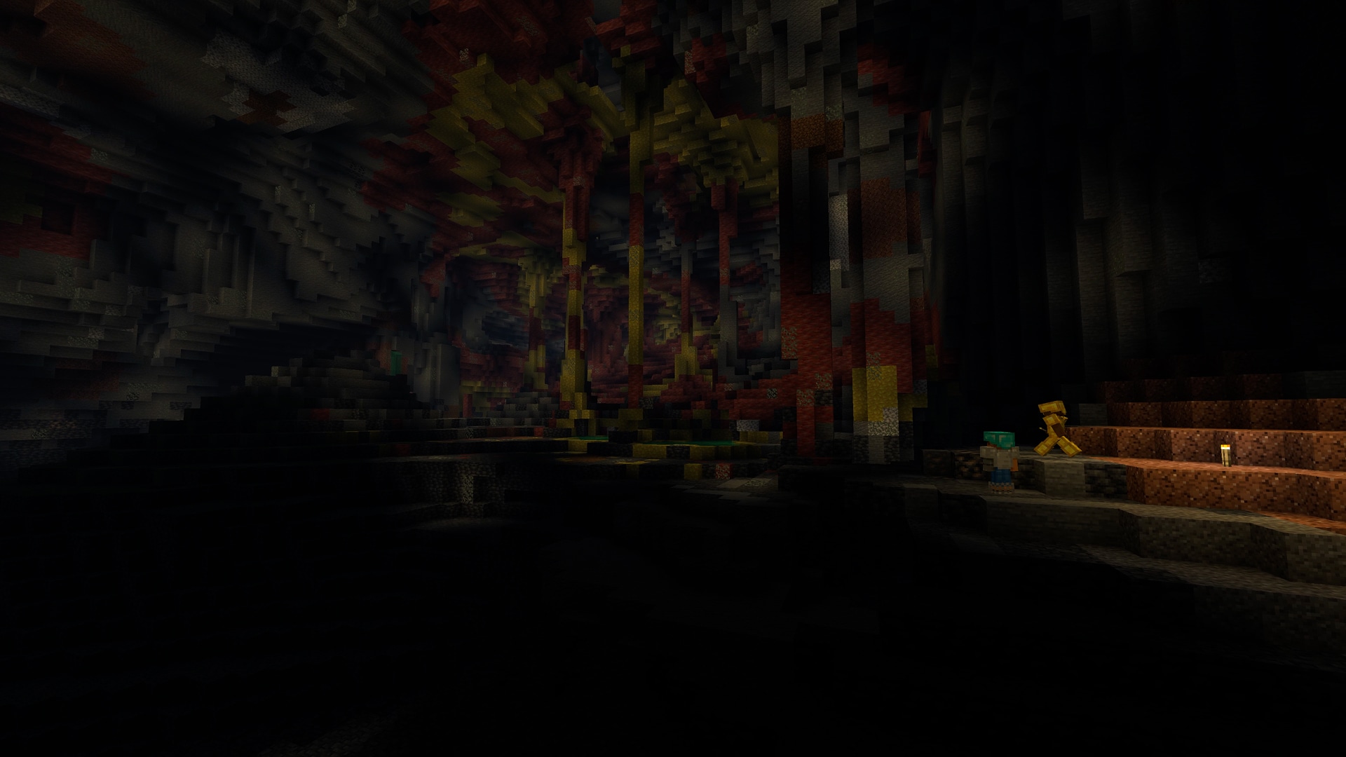 Two players in a dark cavern stand next to a lit torch. A faintly lit sulfur cave looms behind them, filled with colorful rock formations.