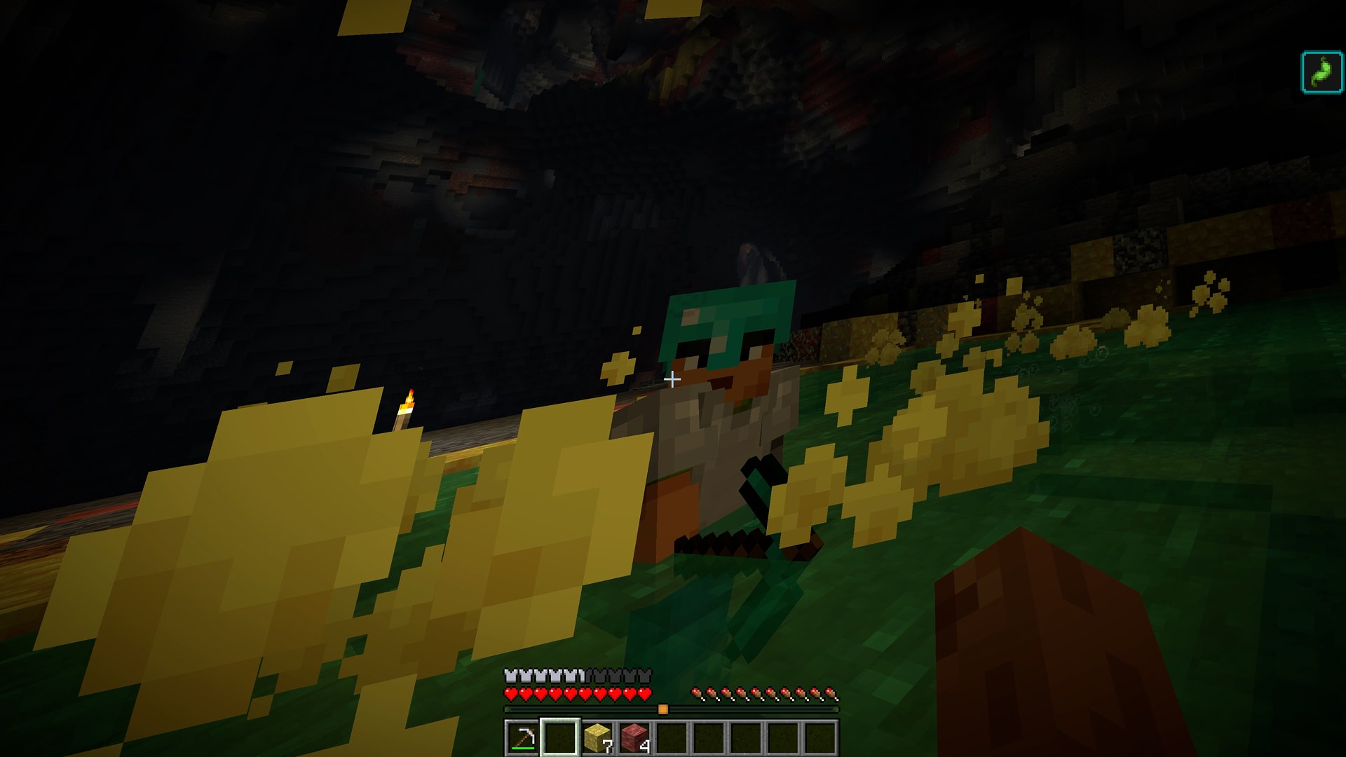First-person view of a player approaching another player standing in a bubbling sulfur pool in a dark cave.