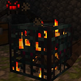 A Minecraft screenshot of a mob spawner inside a monster room.