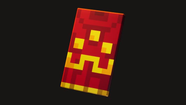 A red cape with golden embroidery, placed on a black background.
